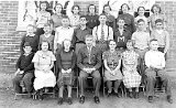 Teacher: Urho Hill.  Photo date unknown but students will be in the graduatiing class of 1941.  Many of these boys, as well as Mr. Hill. will serve during WW-2.